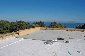 Flat roof specialists working on a commercial roof in WI Flat Roofer Wisconsin