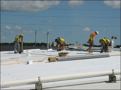 TPO roofing installation process Ixonia WI TPO roofing contractors installing new commercial flat roof